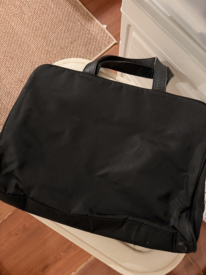 Original & Vintage Prada Nylon Laptop Bag (Category: Laptop Bags & Sleeves) located in Pasig City. Submitted by cosmic_ninisells (Listing ID 1469596651, Image 2). Description: 📌Item: Original & Vintage Prada Nylon Laptop Bag 📌 wear and tear on the leather handles but the bag itself is in great condition, see pictures! Can fit my MacBook Neo in the middle zipper compartment for reference. 📌Price: 2,500 negotiable! 📌 Return condition: Check ite