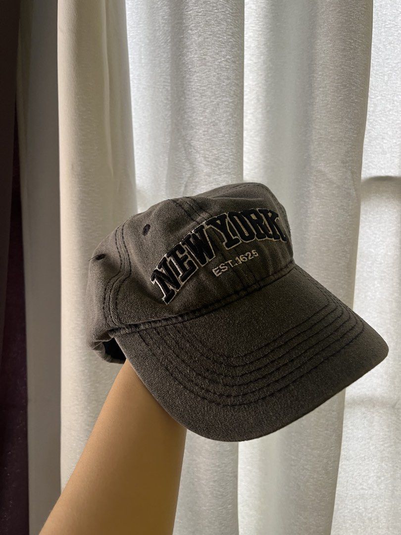 Original Nike and Vintage Style Caps Bundle (Category: Caps & Hats) located in San Jose del Monte. Submitted by thepinkcart_ (Listing ID 1469687848, Image 2). Description: - Set of 3 trendy caps, available individually or as a bundle - Cap 1: Off-white Nike cap with black swoosh and side text graphic - Cap 2: Dark grey washed cap featuring classic New York embroidery - Cap 3: Brown distressed cap with cool text prints and raw hem brim details - P