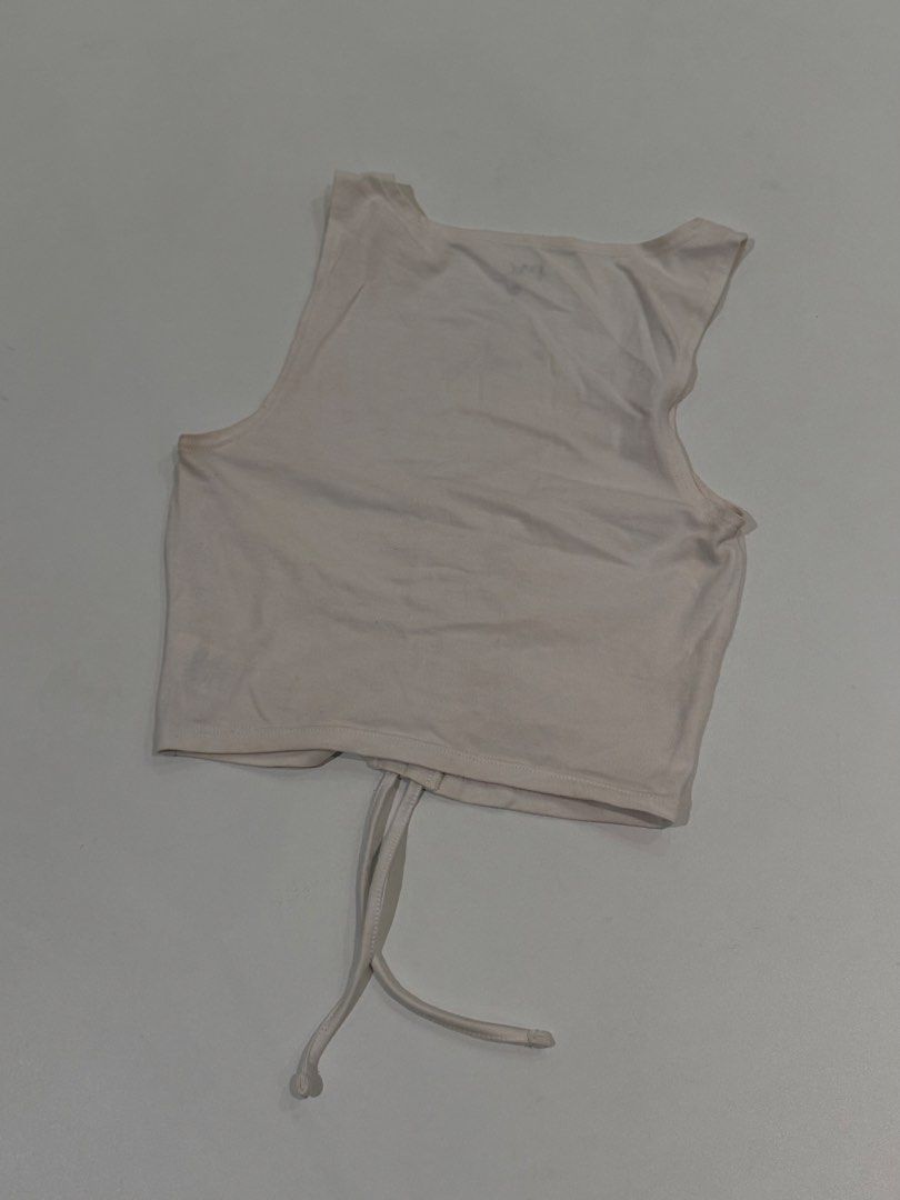PacSun White Ruched Crop Tank Top (Category: Sleeveless) located in Muntinlupa City. Submitted by henlo03 (Listing ID 1469611455, Image 3). Description: - Brand: PacSun - Color: White - Size: XS - Material: Eco-friendly fabric line - Design: Scoop neckline with adjustable center ruching string - Condition: Worn a few times, washed, and carefully stored - Perfect for: Layering or wearing alone on warm days.