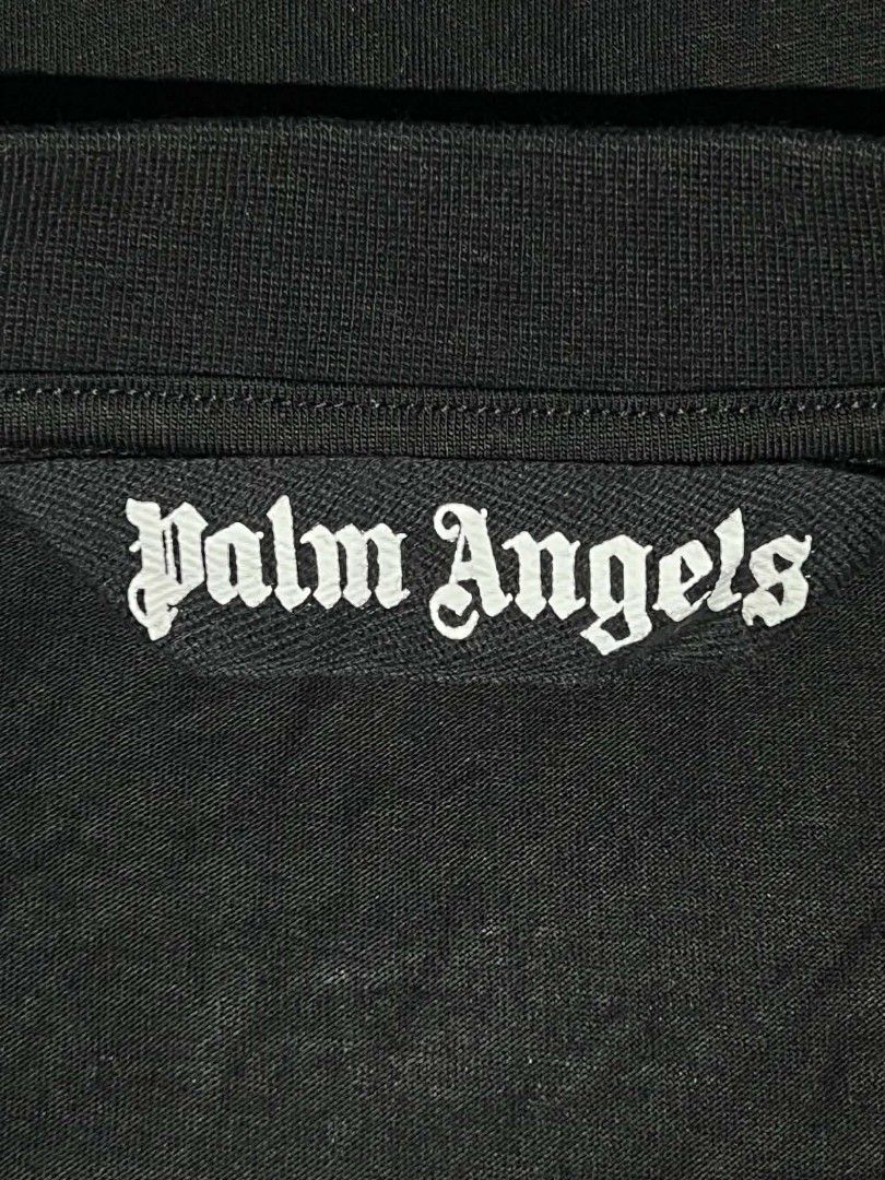 Palm Angels Hula Bears Black Tee Size S (Category: Shirts) located in Urdaneta. Submitted by jayceegarage (Listing ID 1469546479, Image 3). Description: Black cotton t-shirt from Palm Angels. Graphic print on the chest with two hula bears playing music. Pink Palm Angels logo underneath. Ribbed crew neck collar. Size small tag attached inside. Care and composition labels intact. with issue check last photo super visible issue unnoticeable po.