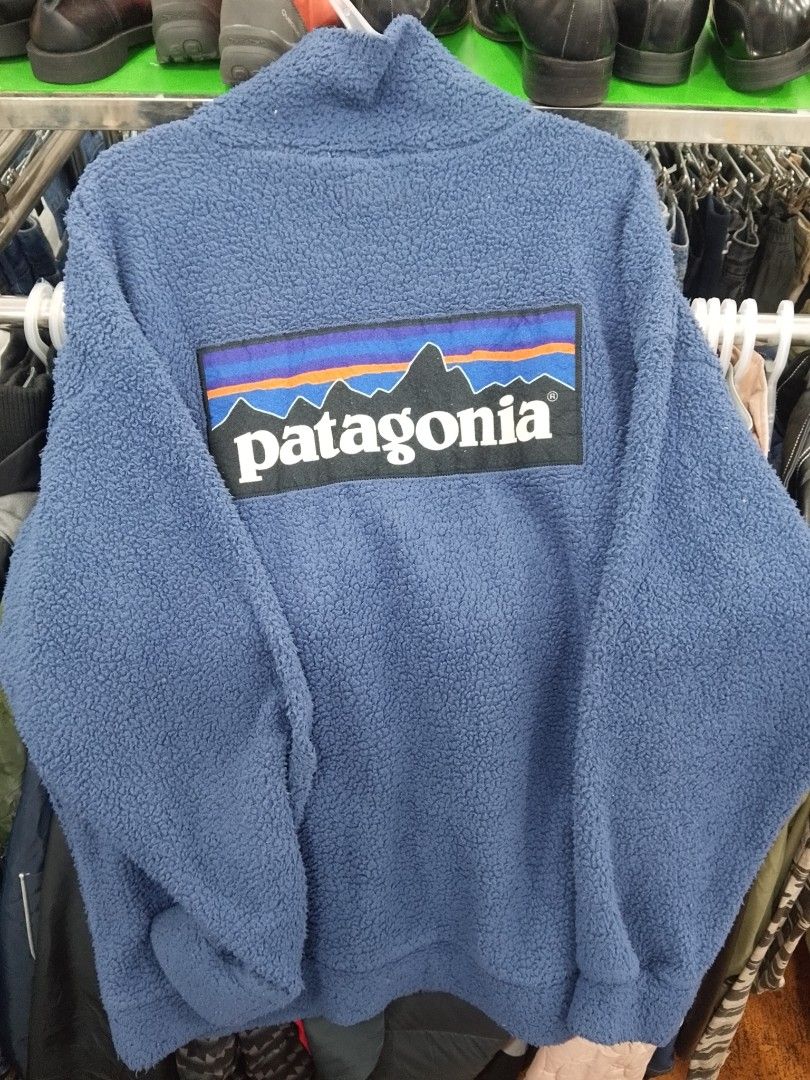 Patagonia Blue Fleece Pullover with Back Logo (Category: Coats, Jackets and Outerwear) located in Manila. Submitted by afreemf (Listing ID 1469643318, Image 2). Description: - Brand: Patagonia - Style: Quarter-zip fleece pullover with stand-up collar - Color: Nice blue shade - Material: Cozy sherpa fleece, perfect for chilly weather - Design: Large Patagonia mountain logo patch on the back - Condition: Excellent / Good as new - Shipping: Via J&T 