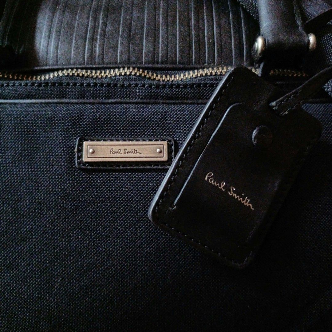 Paul Smith Black Canvas & Ribbed Leather Laptop Briefcase Bag (Category: Briefcases) located in Cagayan de Oro. Submitted by a.lalay (Listing ID 1469650813, Image 2). Description: Selling an original, premium Paul Smith executive business laptop briefcase. Sleek, multi-compartment design perfect for corporate work, travel, or daily commutes. Premium Materials: Robust black ballistic canvas paired with a distinct ribbed leather accent panel on top