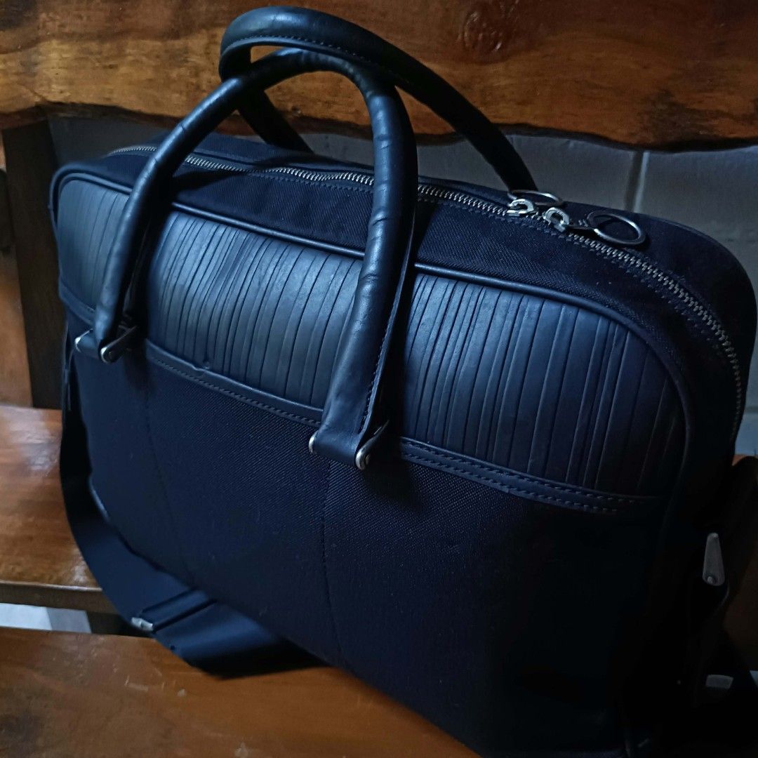 Paul Smith Black Canvas & Ribbed Leather Laptop Briefcase Bag (Category: Briefcases) located in Cagayan de Oro. Submitted by a.lalay (Listing ID 1469650813, Image 3). Description: Selling an original, premium Paul Smith executive business laptop briefcase. Sleek, multi-compartment design perfect for corporate work, travel, or daily commutes. Premium Materials: Robust black ballistic canvas paired with a distinct ribbed leather accent panel on top