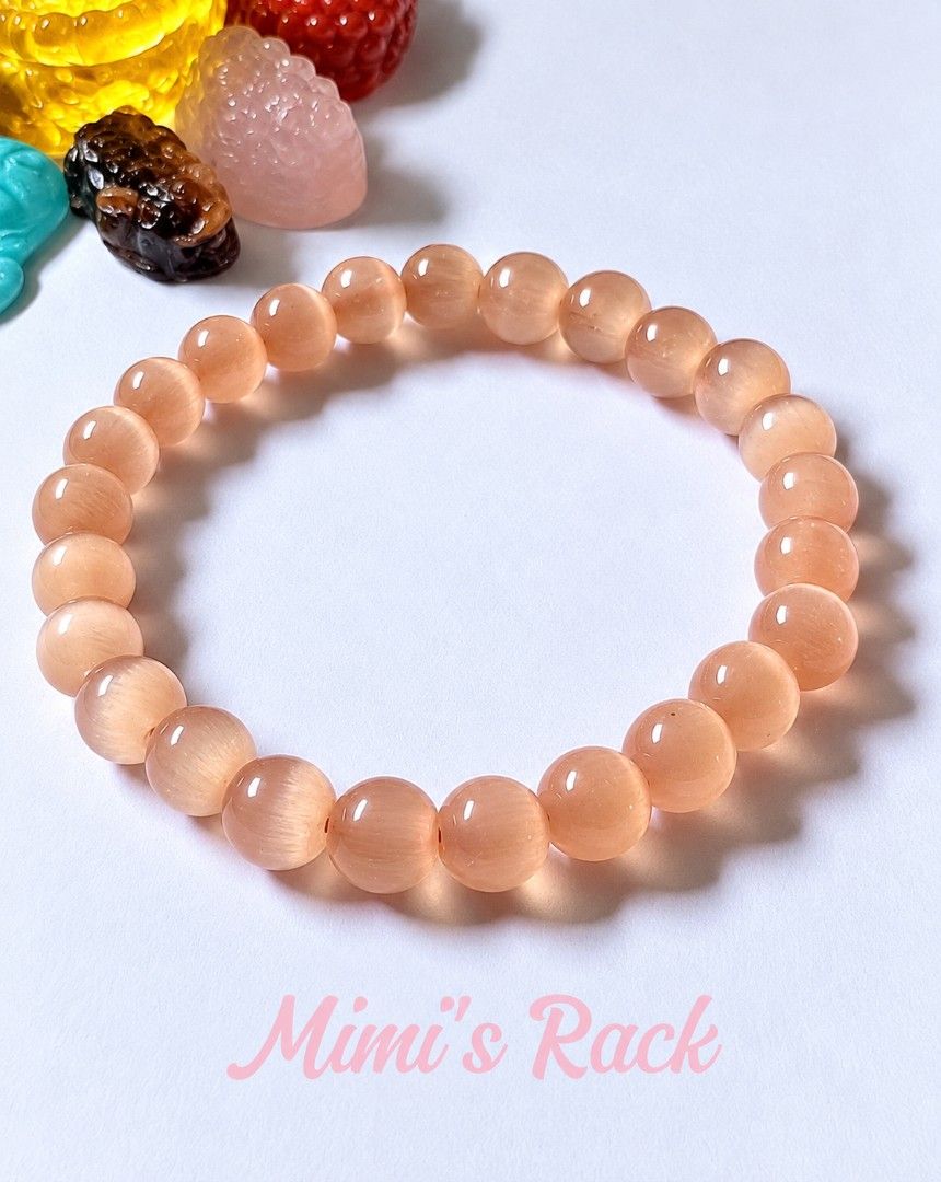 Peach Cat's Eye Stone Bracelet (Category: Bracelets) located in Taguig. Submitted by mimisrack (Listing ID 1469722655, Image 3). Description: 🧡🛡️ Protection & Intuition — cat’s eye stones are traditionally associated with protection, awareness, and trusting your instincts. ❤️ Love & Warmth — peach tones symbolize affection, tenderness, and harmonious relationships. 💗 Self-Love & Compassion — represents self-acceptance, kindness, and emotional 