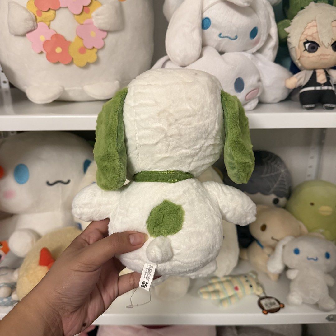 Peanuts Green Snoopy Plush Toy (Category: Plushies & Soft Toys) located in Taguig. Submitted by exidofficial (Listing ID 1469689550, Image 2). Description: - Official Peanuts Snoopy plush toy in a rare green and white design - Features a cute four-leaf clover embroidered on the chest - Bright green nose, floppy ears, and matching collar - Made with ultra-soft, huggable material - Original tag still attached at the back - Super clean, well-kept, a