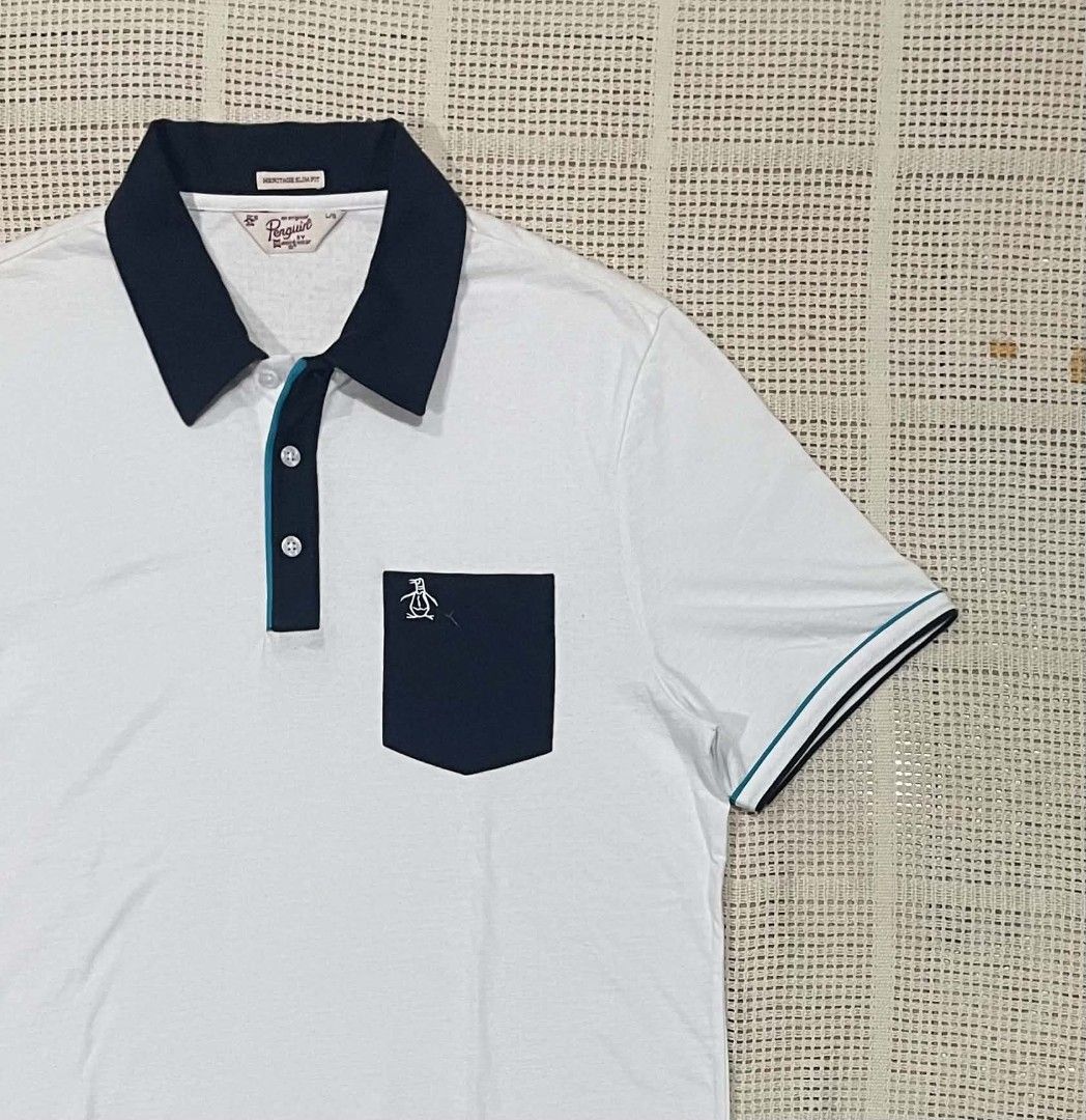 Penguin by Munsingwear Polo Shirt (Category: Luxury Apparel) located in Bacolod City. Submitted by abkicks_apparel (Listing ID 1469729230, Image 3). Description: Penguin by Munsingwear Polo Shirt ( Heritage Slim Fit ) Large on Tag W21 L28.5 Authentic Original As New Condition No Hidden Issues .