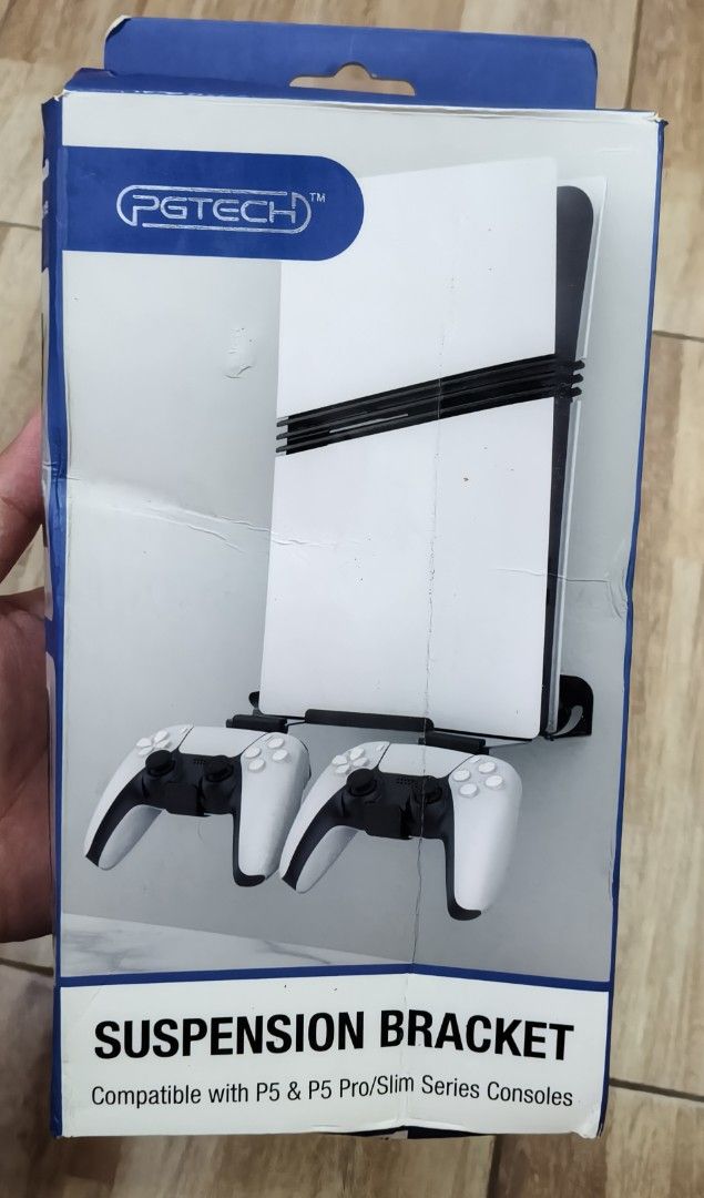 PGTECH Suspension Bracket for P5 & P5 Pro/Slim Consoles (Category: Controllers) located in Bamban. Submitted by jpthrift_90210 (Listing ID 1469726019, Image 1). Description: - Brand: PGTECH - Compatibility: PS5 and PS5 Pro/Slim consoles - Color: Black - Condition: Brand new in box, contents unopened - Inclusions: Wall mount bracket, 2 controller storage brackets, console fixing screws, wall screws, screwdriver, and hole calibration label - Featur