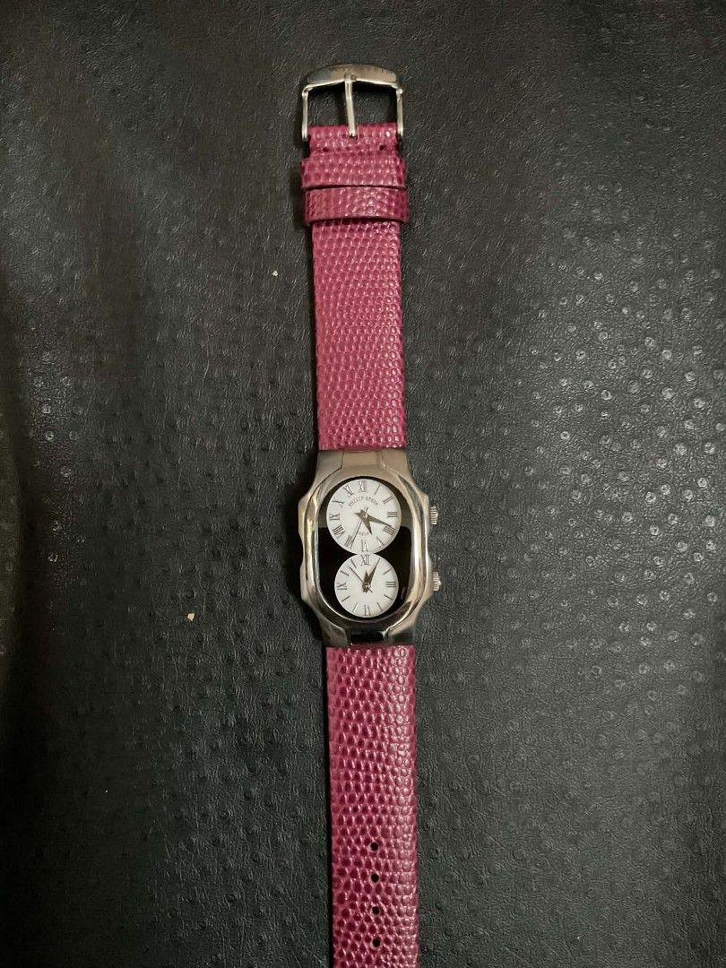 Philip Stein Dual Time Zone Wristwatch Maroon Strap (Category: Women's Watches) located in Malolos. Submitted by lizarondoe59660 (Listing ID 1469573724, Image 1). Description: - Brand: Philip Stein - Style: Dual time zone watch with a distinctive dual-dial layout - Dials: Dual white mother-of-pearl sub-dials featuring classic Roman numerals - Case: Polished stainless steel curved rectangular case - Strap: Textured maroon leather strap with a stan