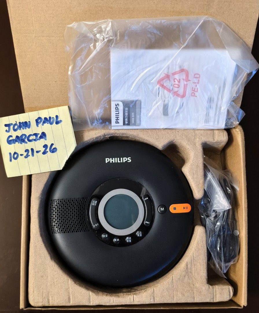 Philips Portable CD Player 5000 Series (Category: Portable Music Players) located in Bamban. Submitted by gooogleu253 (Listing ID 1469704031, Image 2). Description: - Model: Philips 5000 Series Portable CD Player (Black) - Versatile Playback: Supports CD, MP3, USB, and TF card - Condition: New open box, exceptionally clean and working perfectly - Inclusions: Comes with original box, user manual, and charging cable - Ready to use: Plug and play yo