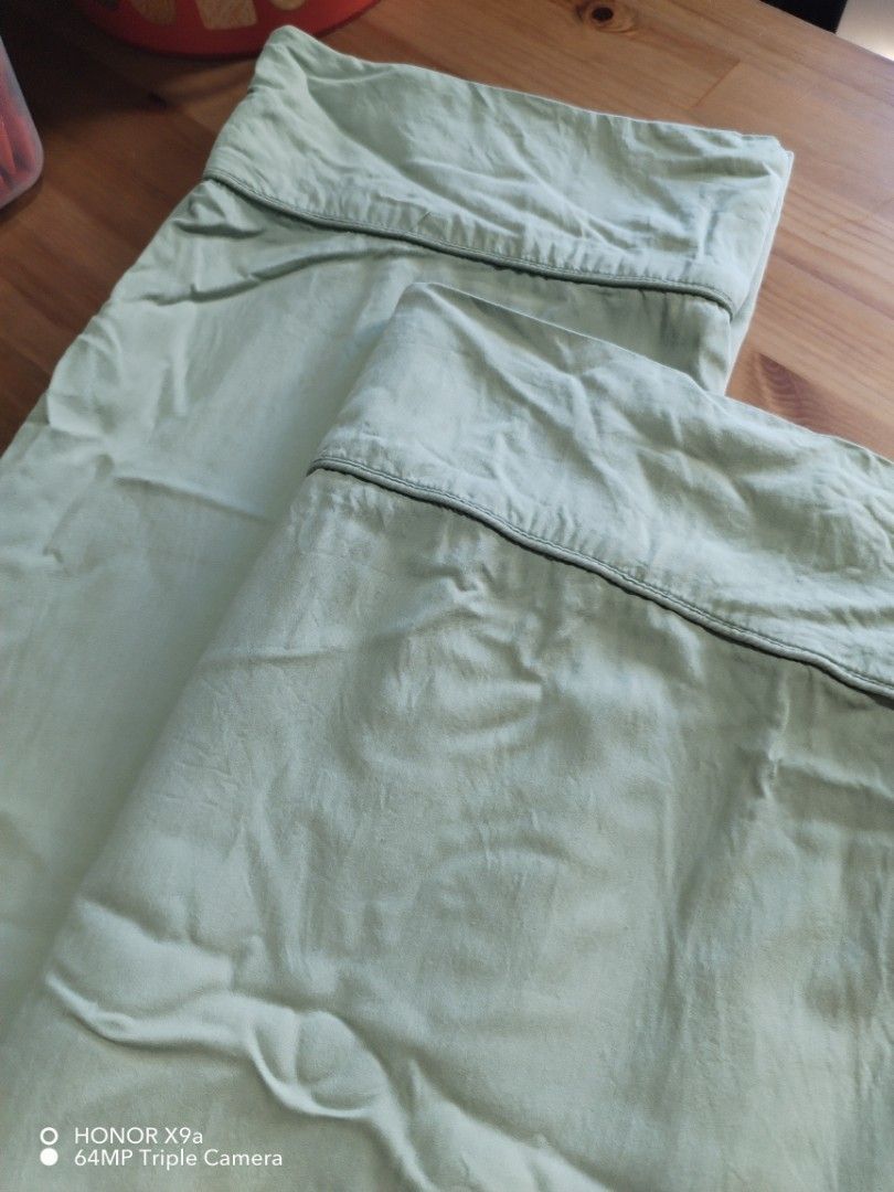 Pillow case ( Long) (Category: Bedding & Towels) located in Muntinlupa City. Submitted by arciagamaryann68 (Listing ID 1469590528, Image 2). Description: - Type: Long Pillow Case - Color: Light Green with dark piping accent - Perfect for standard long pillows - Soft and comfortable material cotton fabric need lang ng Plantsa.