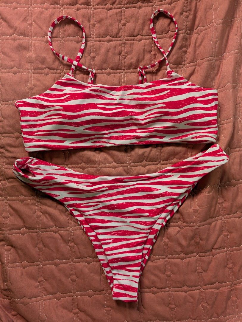 Pink and white zebra print two piece bikini set (Category: Bikinis & Swimsuits) located in Manila. Submitted by deniniii (Listing ID 1469624626, Image 1). Description: - Bold red and white zebra animal print - Complete two-piece set includes matching top and high-cut bottoms - Adjustable straps for a custom and comfortable fit - Clean fabric, hygienic, and ready to wear - Perfect for your next beach trip, pool day, or vacation getaway LARGE TO XL