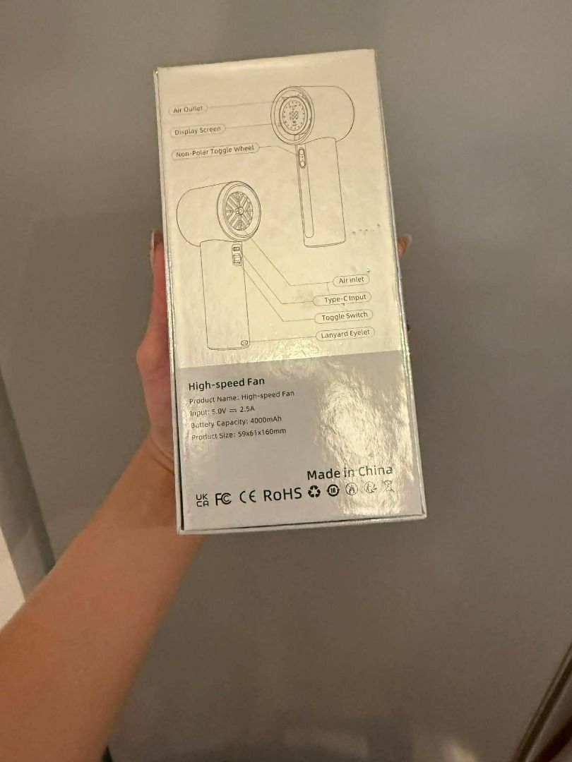 Pink High-Speed Handheld Fan with Display Screen (Category: Fans) located in Manila. Submitted by moond_st (Listing ID 1469718172, Image 3). Description: - Color: Stylish Pink - Battery Capacity: 4000mAh for long-lasting use - Charging: Type-C input (5.0V 2.5A) - Control: Non-polar toggle wheel with a clear digital display screen - Design: Compact size (59x61x160mm) with a handy lanyard eyelet - Inclusion: Comes complete with the original box.