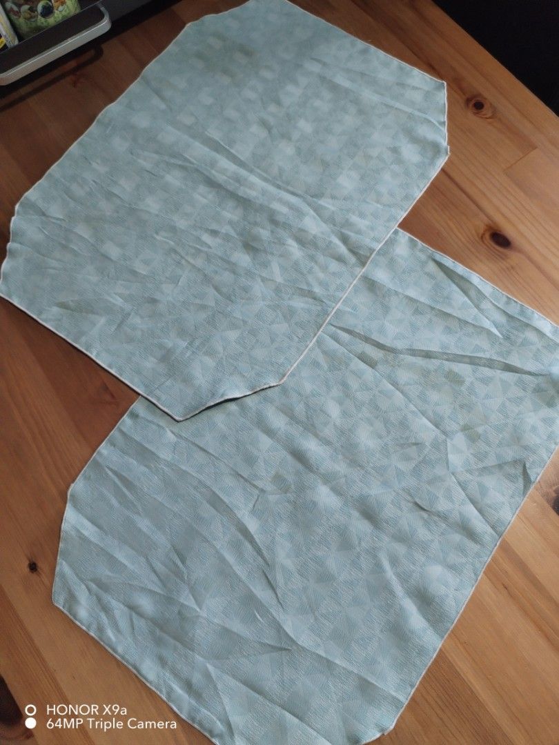 Placemat (Category: Towels, Napkins & Holders) located in Muntinlupa City. Submitted by arciagamaryann68 (Listing ID 1469602964, Image 3). Description: - Set of pre-loved table placemats - Features two distinct designs: floral quilted pattern and textured solid light green - Soft color palette including blue, pink, and green - Great for dining table protection and aesthetic setup.