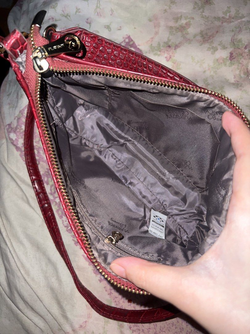 PLAYBOY BUNNY BAG (Category: Shoulder Bags) located in Bulacan. Submitted by sgnzj (Listing ID 1469654776, Image 2). Description: COMES WITH SLING BAG MINIMAL COLOR TRANSFER AT THE BACK OF THE BAG BUT INSIDE AND OTHER PARTS OF THE BAG HAS NO FLAWS AND CLEAN ZIPPERS ARE ALL FUNCTIONAL BUT HARDWARES ARE FADED .
