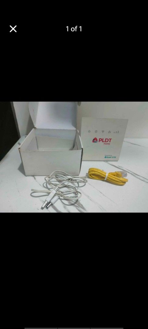 PLDT Home WiFi Router with Box and Cables (Category: Networking) located in Manila. Submitted by billythekid05 (Listing ID 1469721874, Image 1). Description: - Authentic PLDT Home WiFi unit in its original white box - Includes yellow Ethernet LAN cable - Comes with white power cable featuring double barrel jacks - Ideal as a reliable spare unit or network replacement - Ready for quick setup and deployment.