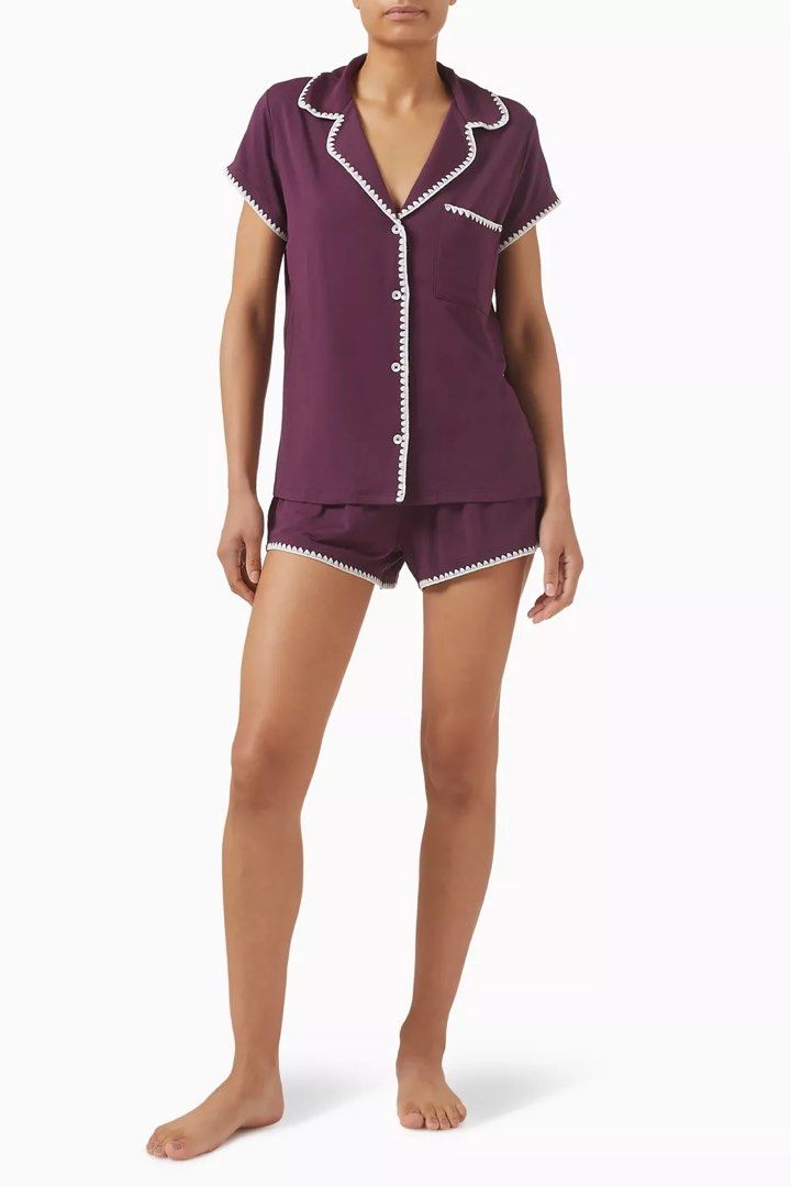 Plum Short Sleeve Pajama Set (Category: Sets or Coordinates) located in Makati City. Submitted by belizalde4 (Listing ID 1469657566, Image 1). Description: - Color: Plum purple with contrasting white scalloped trim - Set includes: Short-sleeve button-up top with chest pocket and matching shorts - Comfort: Elastic waistband on shorts for easy lounging - Material: Super soft, cozy fabric - Details: Chic scalloped edges along the collar, placket, po