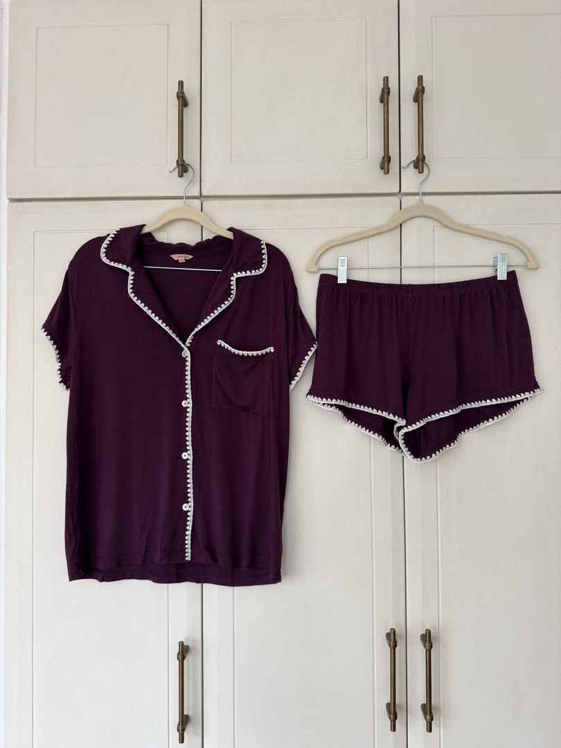 Plum Short Sleeve Pajama Set (Category: Sets or Coordinates) located in Makati City. Submitted by belizalde4 (Listing ID 1469657566, Image 2). Description: - Color: Plum purple with contrasting white scalloped trim - Set includes: Short-sleeve button-up top with chest pocket and matching shorts - Comfort: Elastic waistband on shorts for easy lounging - Material: Super soft, cozy fabric - Details: Chic scalloped edges along the collar, placket, po