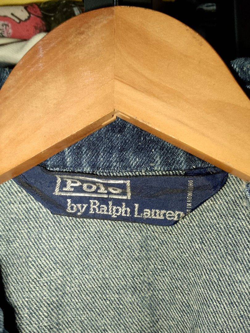 Polo by Ralph Lauren Blue Denim Jacket (Category: Coats, Jackets and Outerwear) located in Manila. Submitted by mjthrifted_second (Listing ID 1469639867, Image 3). Description: - Brand: Polo by Ralph Lauren - Style: Classic dark wash full-zip denim jacket -Dimes: 24/25 - Details: Iconic red embroidered polo player logo on chest - Pockets: Two front welt pockets - Fit: Elasticized hem at the back for a snug fit - Condition: Excellent quality with 