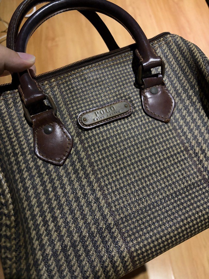 Polo Ralph Lauren Houndstooth Boston Bag (Category: Luxury Bags & Wallets) located in Manila. Submitted by austinver91082 (Listing ID 1469723177, Image 1). Description: RFS: Decluttering - Brand: Polo Ralph Lauren - Style: Boston bag / Handbag - Pattern: Brown and black houndstooth - Material: Sturdy dark brown leather handles and trim - Closure: Zip-top - Details: Signature metal logo plaque on the front - Condition: Vintage charm with minor sig
