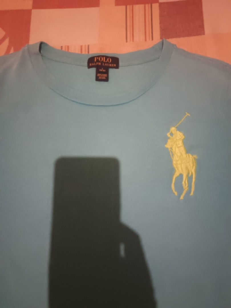 Polo Ralph Lauren tshirt (Category: Activewear) located in Odiongan. Submitted by thriftngo26 (Listing ID 1469581174, Image 2). Description: This is a turquoise blue Polo Ralph Lauren short-sleeve t-shirt featuring a lime-green embroidered Big Pony logo on the chest and the number "3" appliqué on the sleeve.