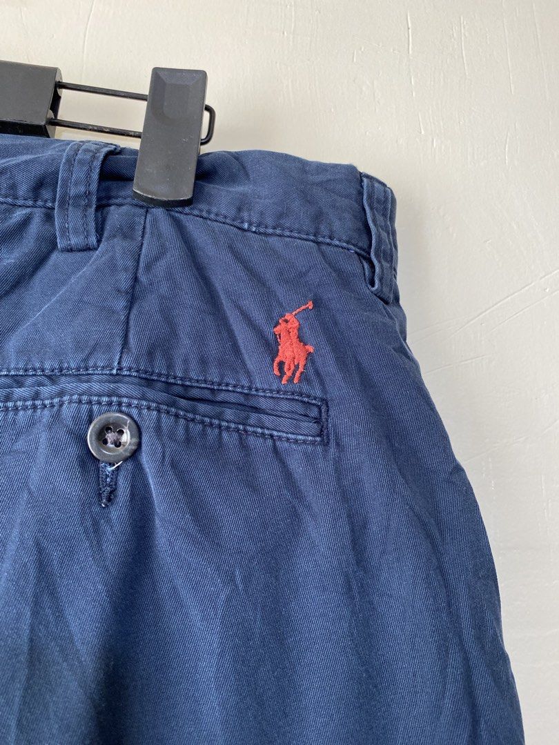 POLO RALPH LAUREN,Chino short (Category: Shorts) located in Cavite. Submitted by jc_thrift95 (Listing ID 1469655334, Image 3). Description: - a pair of navy blue men’s chino shorts by Polo Ralph Lauren, featuring a red embroidered pony logo above the back pocket. - Made in Sri lanka - L- 20 inch - W- 18 inch - Color rate 8/10 - See picture details for dimes. .