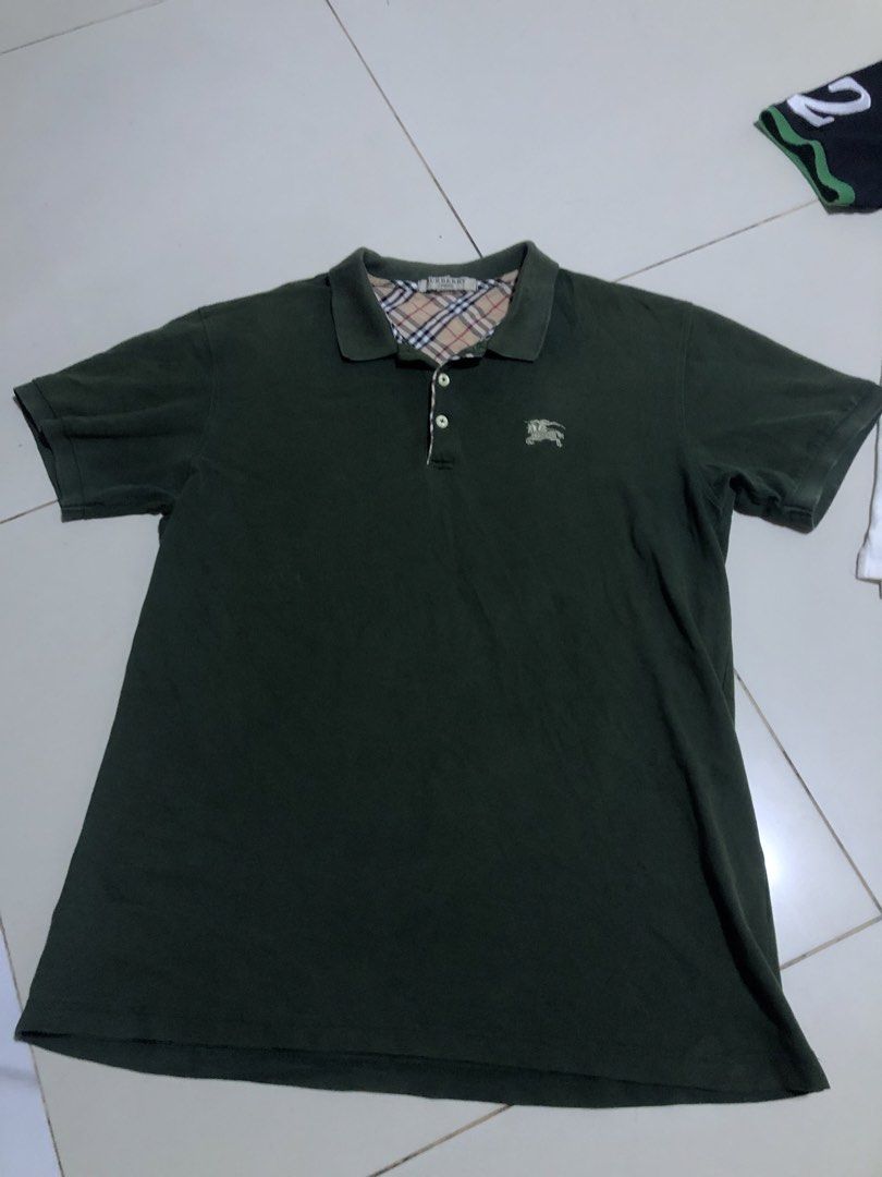 Polo Shirt By BURBERRY (Category: Tshirts & Polo Shirts ) located in Manila. Submitted by messiah.vanriz (Listing ID 1469739603, Image 1). Description: 9/10 condition, the only issue is the buttons are replaced (i can send proofs that it is infact replaced).