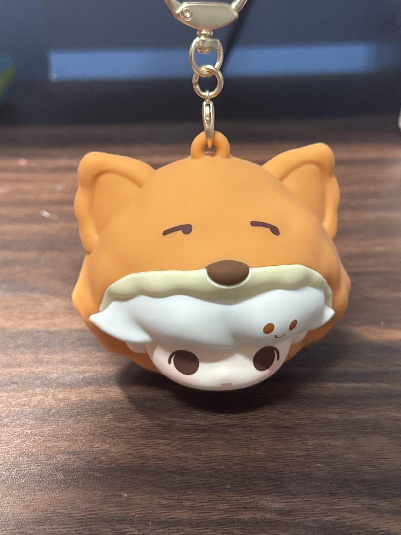 Pop Mart Dimoo World Fox Plush Pendant Keychain (Category: Plushies & Soft Toys) located in Makati City. Submitted by khyfra25 (Listing ID 1469630418, Image 1). Description: - Authentic Pop Mart Dimoo World character in an adorable orange fox hood - Features a functional zipper pocket on the back with a POP MART branded pull tab - Equipped with a sturdy gold-toned clasp keychain for easy bag attachment - Detailed with embossed POP MART and DIMOO 