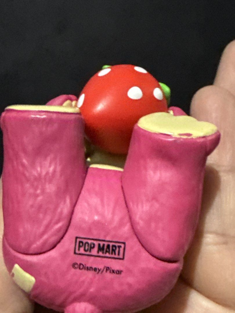 POP MART Disney Pixar Lotso Figurine (Category: Designer & Blind Box Toys) located in Quezon. Submitted by onlysunsun (Listing ID 1469701598, Image 2). Description: - 100% Authentic Pop Mart x Disney Pixar Lotso figure - Adorable design: Pink bear holding a big red strawberry with a cute facial expression - Official merchandise: Bottom stamped with Pop Mart and Disney Pixar logos - Compact size: Fits right in the palm of your hand - Perfect colle