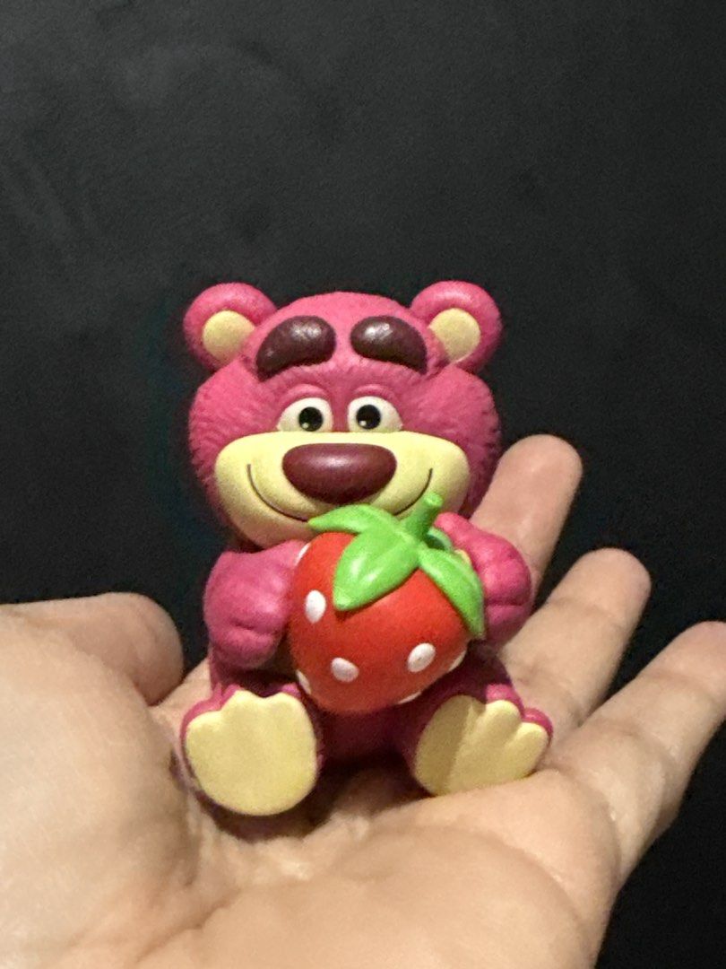 POP MART Disney Pixar Lotso Figurine (Category: Designer & Blind Box Toys) located in Quezon. Submitted by onlysunsun (Listing ID 1469701598, Image 1). Description: - 100% Authentic Pop Mart x Disney Pixar Lotso figure - Adorable design: Pink bear holding a big red strawberry with a cute facial expression - Official merchandise: Bottom stamped with Pop Mart and Disney Pixar logos - Compact size: Fits right in the palm of your hand - Perfect colle