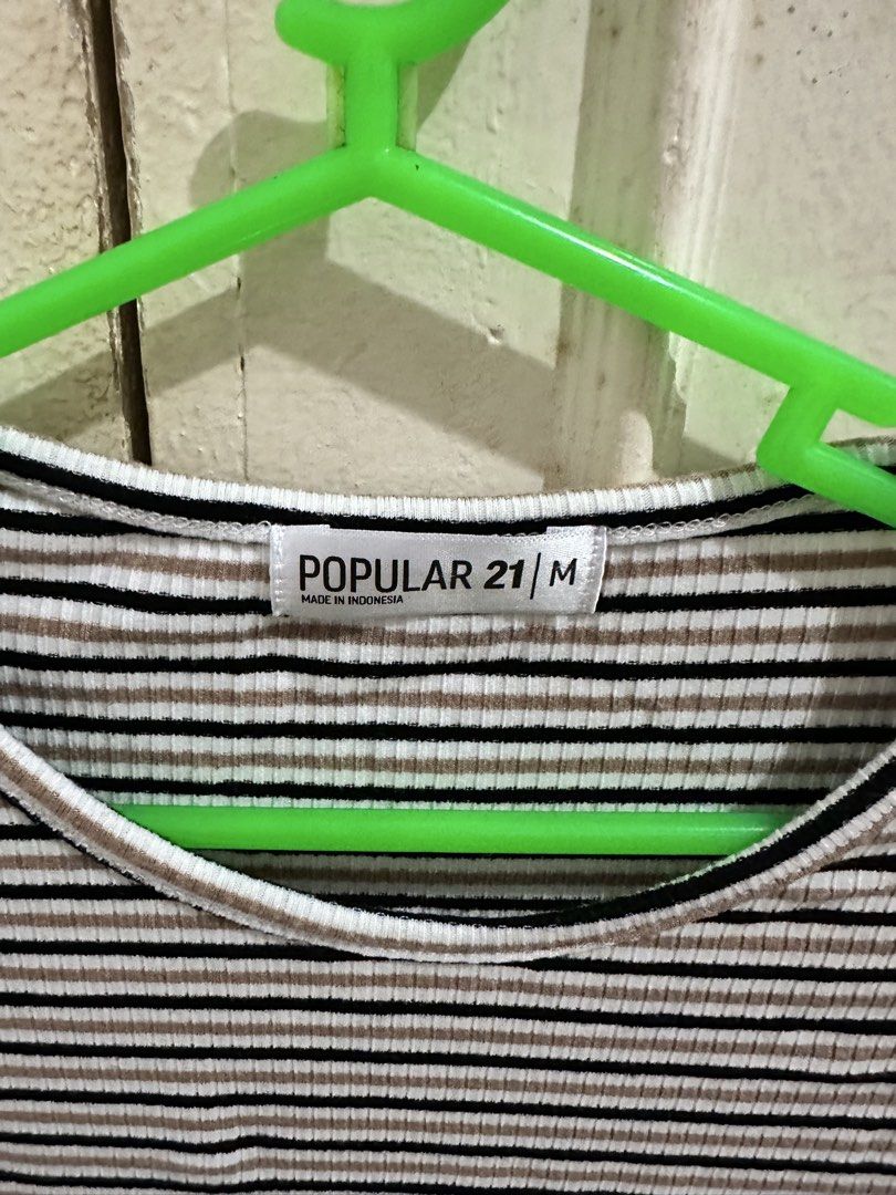 Popular 21 Striped Ribbed Crop Top Size M (Category: Shirts) located in Bugallon. Submitted by lavenderlane (Listing ID 1469708569, Image 2). Description: - Style: Ribbed crop top with black, white, and brown horizontal stripes - Fit: Short sleeves, rounded neckline, stretchy fabric - Size: Tagged M (Made in Indonesia) - Condition: Great everyday basic piece - Styling: Perfect to pair with high-waisted jeans or skirts.