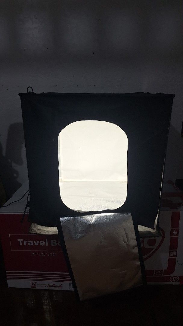 Portable Photo Studio Light Box with Built-in LEDs (Category: Lighting & Studio Equipment) located in Angeles City. Submitted by pamdiel003 (Listing ID 1469613035, Image 1). Description: - Portable black photo studio box for professional product photography - Built-in LED lighting with a convenient dial controller for brightness adjustment - Foldable, compact design that is easy to pack up and store away - Secure front opening flap for multiple s