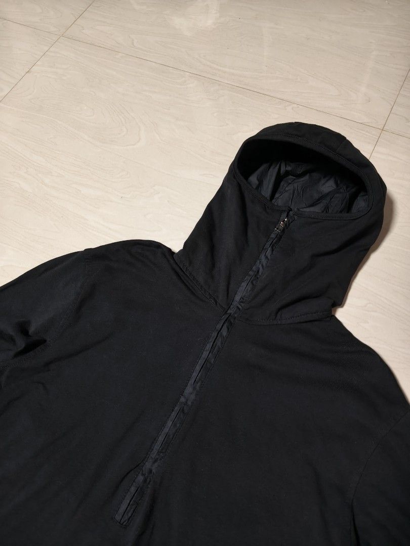 Prada Black Hooded Pullover Jacket (Category: Coats, Jackets and Outerwear) located in Manila. Submitted by si_yannnn (Listing ID 1469721397, Image 3). Description: - Brand: Prada - Color: Classic black - Style: Hooded pullover with half-zip front - Fit: Adjustable drawstrings at the hood and bottom hem - Details: Contrast panel accents on long sleeves - Interior: Fully lined with official 'Made in Italy' neck tag - Condition: Great piece for lay