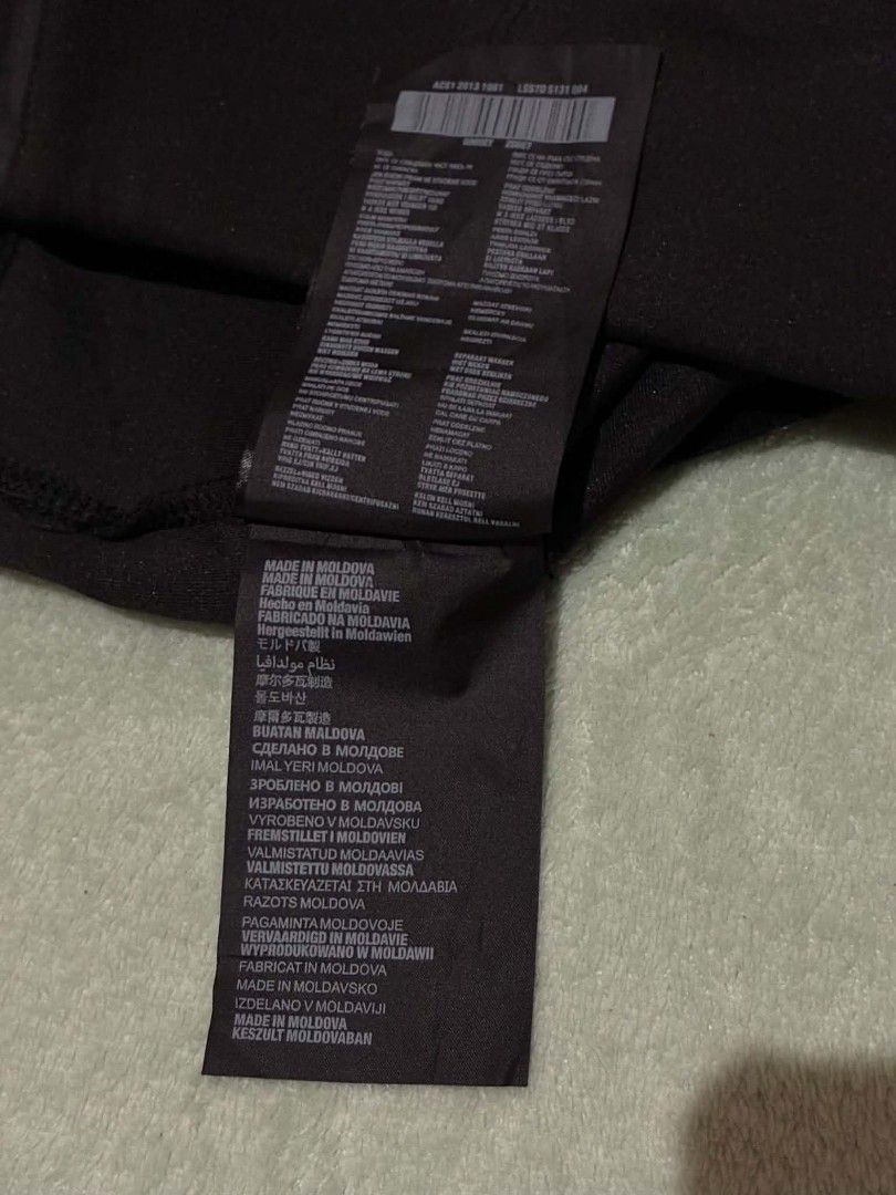 Prada Black Technical Fabric Shorts (Category: Shorts) located in Nabunturan. Submitted by kairosas85 (Listing ID 1469678041, Image 3). Description: - Authentic Prada black shorts - Material: Stretchy technical fabric for ultimate comfort - Fit: Mid-length with an elasticated waistband - Details: Signature enamel triangle logo on the right leg, back pockets - Condition: Brand new with brand tag and care labels attached - Origin: Made in Moldova -