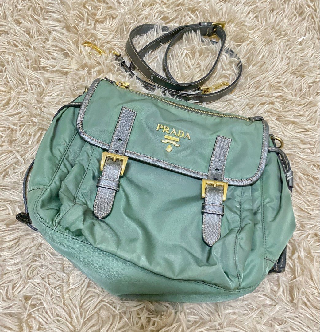 Prada Green Nylon Flap Crossbody Bag (Category: Luxury Bags & Wallets) located in Manila. Submitted by selah_20 (Listing ID 1469680463, Image 1). Description: Details Brand: Prada Milano Color: Green with metallic silver accents Material: Nylon with leather details Hardware: Gold-tone Includes detachable shoulder strap Entrupy Certificate of Authenticity included From UAE Condition: Pre-loved / Vintage The bag has visible discoloration and staini