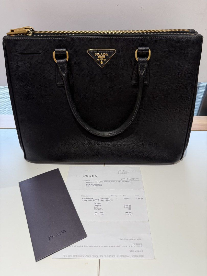 PRADA SAFFIANO LUX TOTE BAG (Category: Luxury Bags & Wallets) located in Paranaque City. Submitted by bealim988 (Listing ID 1469634518, Image 3). Description: 🖤 FOR SALE: PRADA SAFFIANO LUX TOTE BAG 🖤 ✨ Elegant, timeless, and classy! Perfect for everyday use or for elevating your OOTD. 👜 Bought in Singapore • Brand: Prada • Style: Saffiano Lux Tote • Color: Black with gold-tone hardware • Original Purchase Price: ₱120,000 • Selling Price: ₱70,