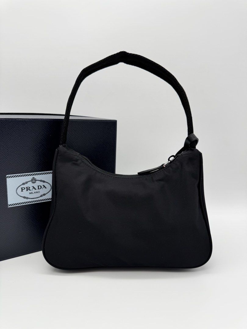 Pr@da Re-Edition 2000 Nylon Mini Bag (Category: Shoulder Bags) located in Calauan. Submitted by giftbags (Listing ID 1469601892, Image 3). Description: ❗️PLEASE READ CAREFULLY ❗️ Prada Re-Edition 2000 Nylon Bag Black/Red 17 cm Height; 6 cm Length; 22 cm width With Box and Dust bag STILL AVAILABLE/ONHAND? Yes. Item not marked as sold means available… 📌NO COD 📌NO LALAMOVE/GRAB 📌NO WHEN WORN 📌ITEMS ARE FOR SHIPPING ONLY - CUT OFF 12nn 📌ALL SALE