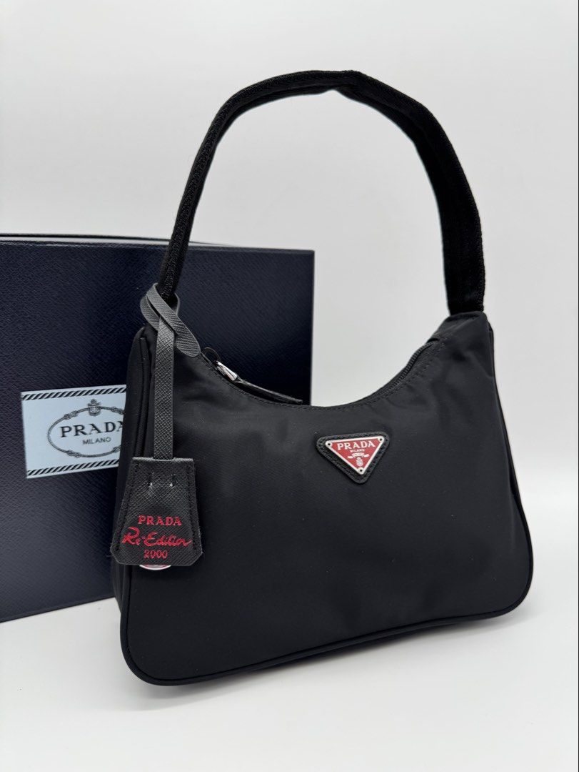 Pr@da Re-Edition 2000 Nylon Mini Bag (Category: Shoulder Bags) located in Calauan. Submitted by giftbags (Listing ID 1469601892, Image 1). Description: ❗️PLEASE READ CAREFULLY ❗️ Prada Re-Edition 2000 Nylon Bag Black/Red 17 cm Height; 6 cm Length; 22 cm width With Box and Dust bag STILL AVAILABLE/ONHAND? Yes. Item not marked as sold means available… 📌NO COD 📌NO LALAMOVE/GRAB 📌NO WHEN WORN 📌ITEMS ARE FOR SHIPPING ONLY - CUT OFF 12nn 📌ALL SALE