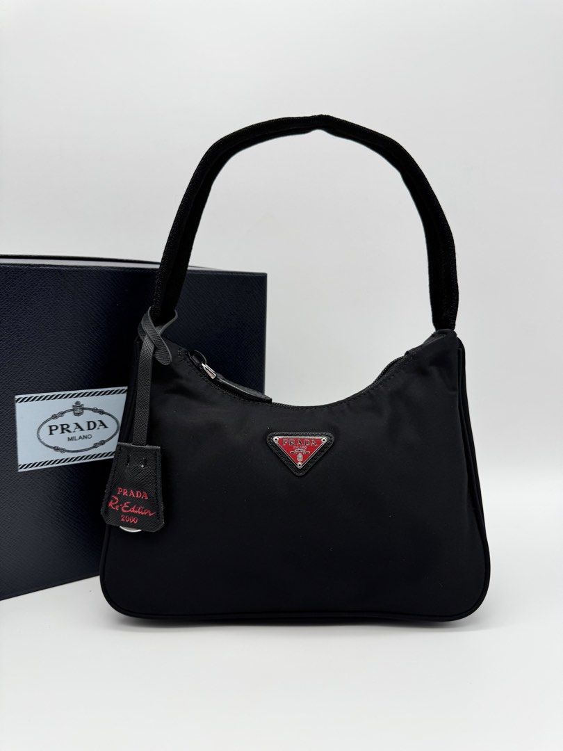 Pr@da Re-Edition 2000 Nylon Mini Bag (Category: Shoulder Bags) located in Calauan. Submitted by giftbags (Listing ID 1469601892, Image 2). Description: ❗️PLEASE READ CAREFULLY ❗️ Prada Re-Edition 2000 Nylon Bag Black/Red 17 cm Height; 6 cm Length; 22 cm width With Box and Dust bag STILL AVAILABLE/ONHAND? Yes. Item not marked as sold means available… 📌NO COD 📌NO LALAMOVE/GRAB 📌NO WHEN WORN 📌ITEMS ARE FOR SHIPPING ONLY - CUT OFF 12nn 📌ALL SALE
