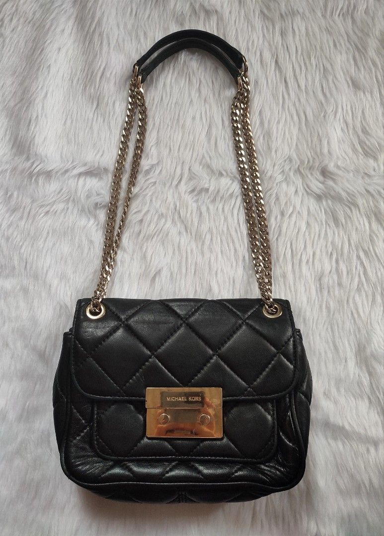 Preloved Michael Kors Chain Bag (Category: Luxury Bags & Wallets) located in Bulacan. Submitted by mandjays (Listing ID 1469602825, Image 1). Description: Good condition with signs of usage like faded hardwares. Please check all pictures posted. Strictly no returning of item. Negotiable!.