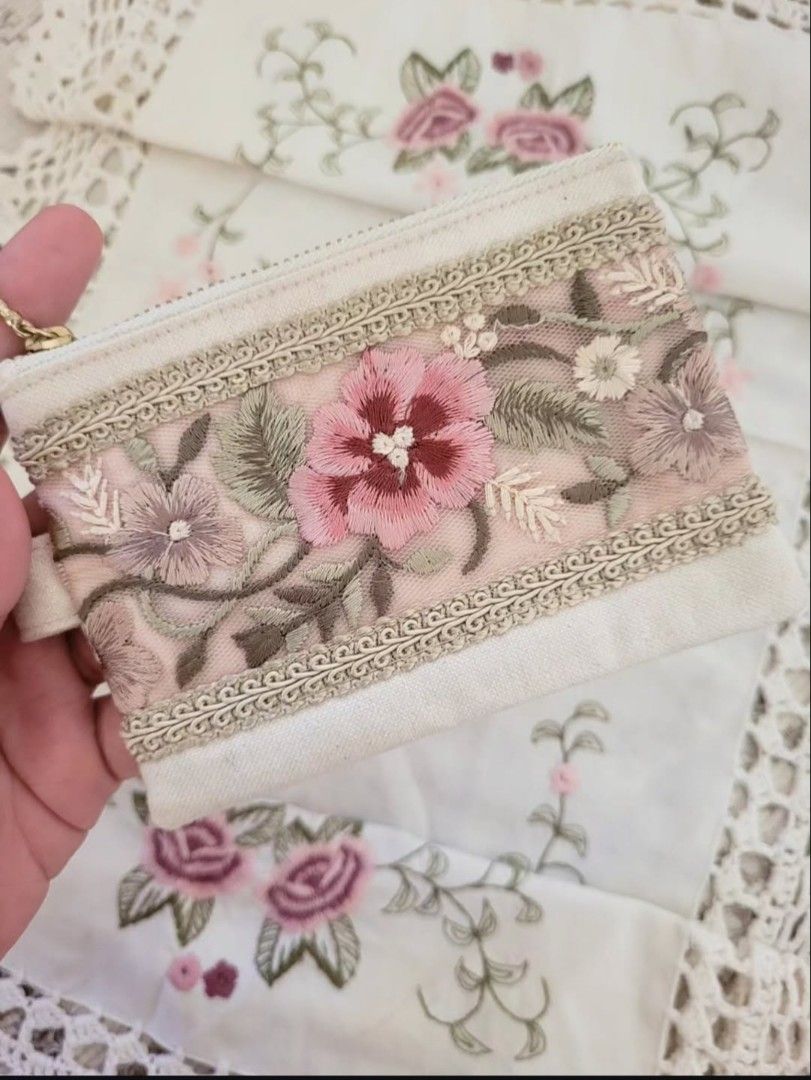 Pretty Floral Embroidered Small Pouch (Category: Purses & Pouches) located in Balanga. Submitted by marae_c (Listing ID 1469577492, Image 2). Description: In very good condition. Like new. Has a very light washable stain sa likod. Other than tha all goods and very pretty. Cute as your coin purse too! Canvas material Rfs. Decluttering. Never used. Have way too many pouches in my bag collection..