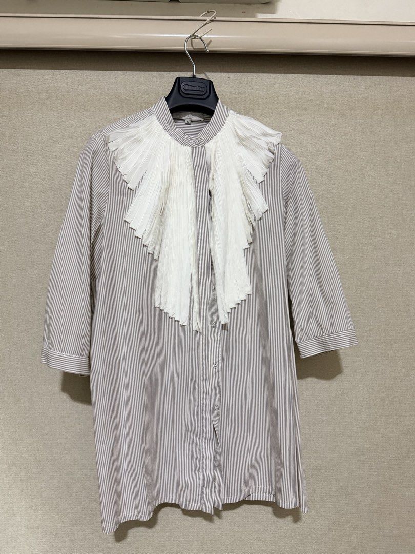 p.studio Striped Shirt with White Ruffle Collar Size 5 (Category: Blouses) located in Cavite. Submitted by mgd.blessed (Listing ID 1469647227, Image 1). Description: - Brand/Model: P.Studio button-down shirt - Color/Pattern: Beige and white stripes - Key Features: Stand-up collar with a large, dramatic white pleated ruffle bib, mid-length sleeves, and front button closure - Size: 5 - Condition: Clean, well-maintained, and ready to wear.