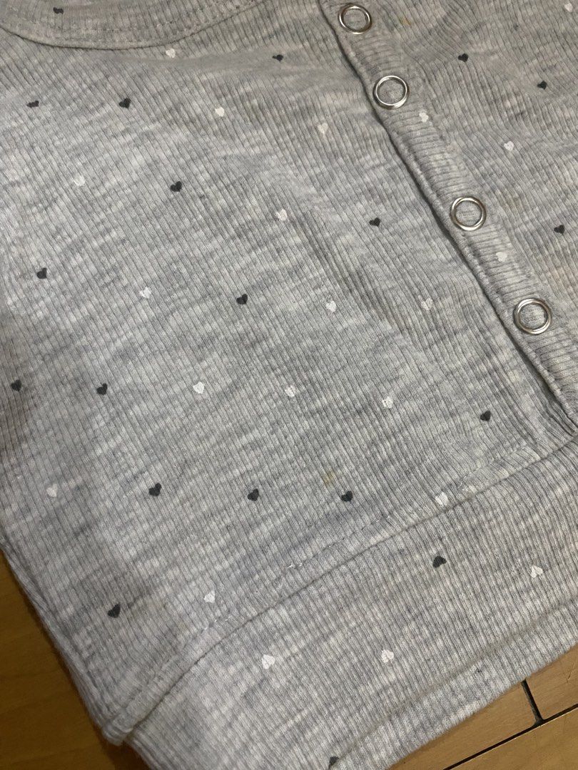 Pull & Bear Grey Heart Print Crop Top Size S (Category: Shirts) located in Marikina City. Submitted by ctgccc (Listing ID 1469694281, Image 3). Description: - Brand: Pull & Bear - Size: S (Made in Bangladesh) - Material: Comfortable cotton blend - Design: Grey ribbed crop top with all-over black and white heart pattern - Details: Scoop neckline, front snap button placket, and short sleeves with lettuce hem - Condition: Great casual piece, ready t