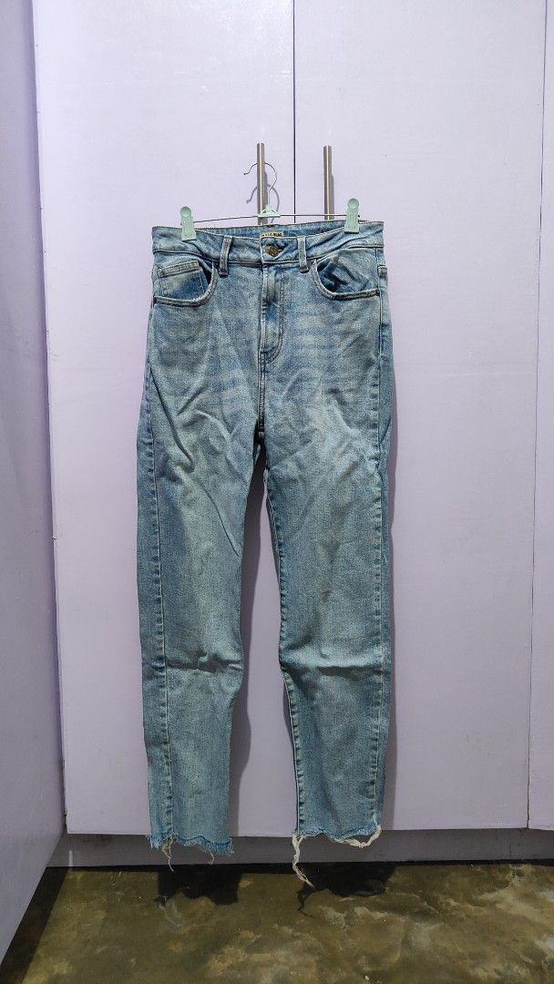 Pull & Bear Light Blue High Waist Jeans (Category: Jeans) located in Bacolor. Submitted by annjjjjj (Listing ID 1469657145, Image 1). Description: - Brand: Pull & Bear - Style: High waist, straight cut leg with raw frayed hem - Wash: Light wash denim - Details: Standard 5-pocket design, button and zip fly closure - Measurements: ~14" waist across (laying flat), ~39" total length - Condition/Vibe: Great casual staple, perfect for everyday wear wit