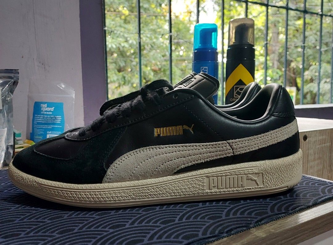 Puma Classic Sneakers (Category: Sneakers) located in Quezon City. Submitted by sulitcorner (Listing ID 1469574580, Image 1). Description: -Nego, madali ako kausap 🙂 -Brand: Puma - Upper: Premium black leather with off-white suede formstripes - Midsole: Textured light-beige rubber - Details: Iconic Puma gold foil logo on side and tongue, white cat logo patch on heel - Outsole: Clean rubber with circular traction pattern - Laces: Standard black l