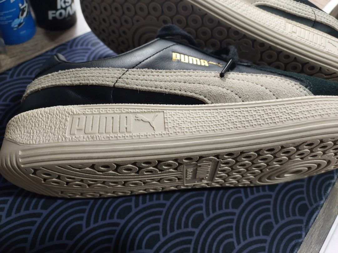 Puma Classic Sneakers (Category: Sneakers) located in Quezon City. Submitted by sulitcorner (Listing ID 1469574580, Image 3). Description: -Nego, madali ako kausap 🙂 -Brand: Puma - Upper: Premium black leather with off-white suede formstripes - Midsole: Textured light-beige rubber - Details: Iconic Puma gold foil logo on side and tongue, white cat logo patch on heel - Outsole: Clean rubber with circular traction pattern - Laces: Standard black l