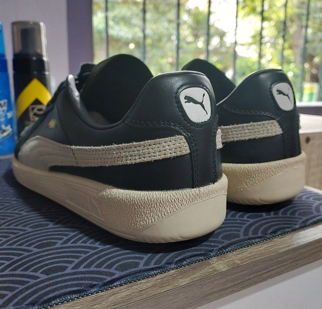 Puma Classic Sneakers (Category: Sneakers) located in Quezon City. Submitted by sulitcorner (Listing ID 1469574580, Image 2). Description: -Nego, madali ako kausap 🙂 -Brand: Puma - Upper: Premium black leather with off-white suede formstripes - Midsole: Textured light-beige rubber - Details: Iconic Puma gold foil logo on side and tongue, white cat logo patch on heel - Outsole: Clean rubber with circular traction pattern - Laces: Standard black l