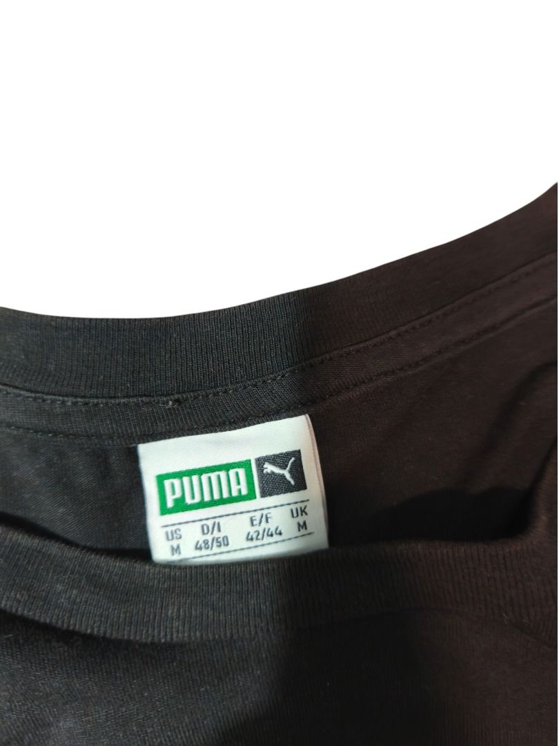 Puma Black Iridescent Logo Tee (Category: Tshirts & Polo Shirts ) located in Baguio. Submitted by boneteezandharmony (Listing ID 1469664463, Image 2). Description: Black Puma tee featuring a large iridescent Cat logo and PUMA lettering with a multicolor reflective effect. A simple athletic staple with a standout graphic. Condition: 9/10 Size on tag: M Dimes: Approx. 19W × 30L.