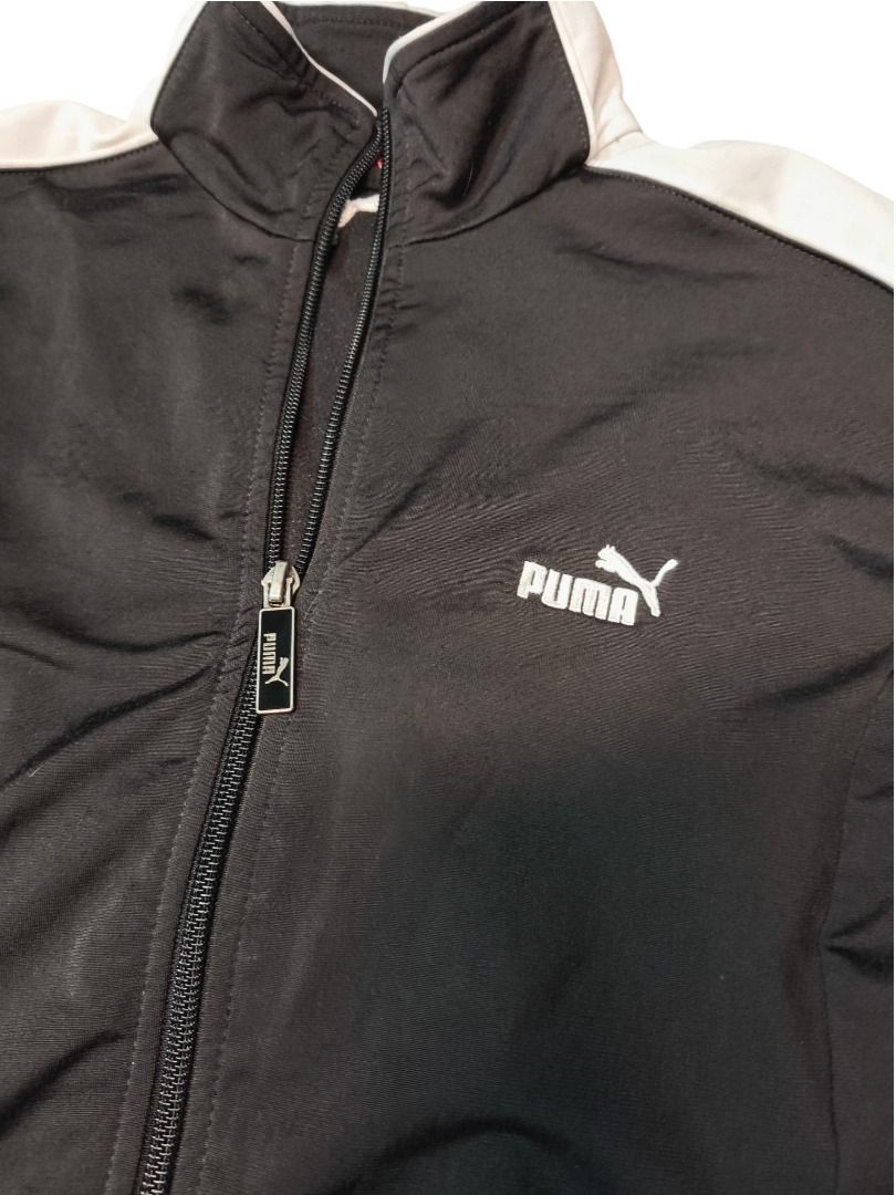 PUMA TRACK JACKET (Category: Coats, Jackets and Outerwear) located in Baguio. Submitted by boneteezandharmony (Listing ID 1469665137, Image 3). Description: Black Puma zip-up with white contrast sleeve panels and a clean chest logo. Easy everyday sportswear staple. Condition: Very Good Size on tag: M Dimes: Approx. 19” width × 23” length.