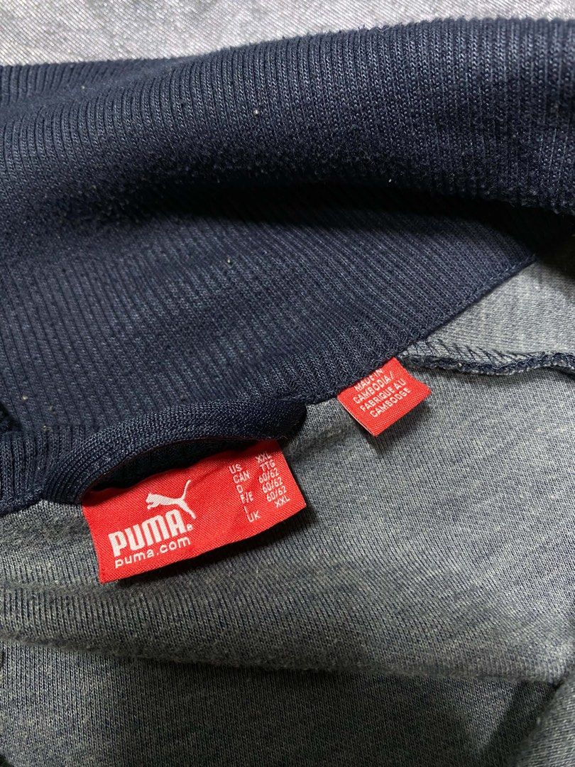 Puma Track Jacket Navy Blue Orange XXL (Category: Coats, Jackets and Outerwear) located in Cavite. Submitted by bellewii (Listing ID 1469680461, Image 3). Description: - Brand: Puma - Color: Navy blue with bright orange stripes and logo - Size: XXL (red neck tag) - Features: High stand-up collar, full zip front with branded metal pull tab - Origin: Made in Cambodia - Condition: Excellent pre-loved condition.