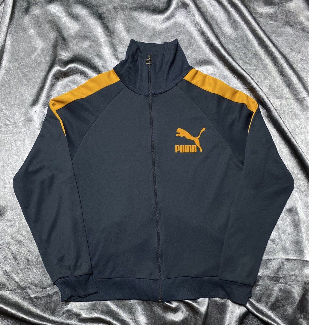 PUMA Track Jacket with Orange Shoulder Stripes (Category: Coats, Jackets and Outerwear) located in General Trias. Submitted by kevinthriftshop (Listing ID 1469679299, Image 1). Description: .